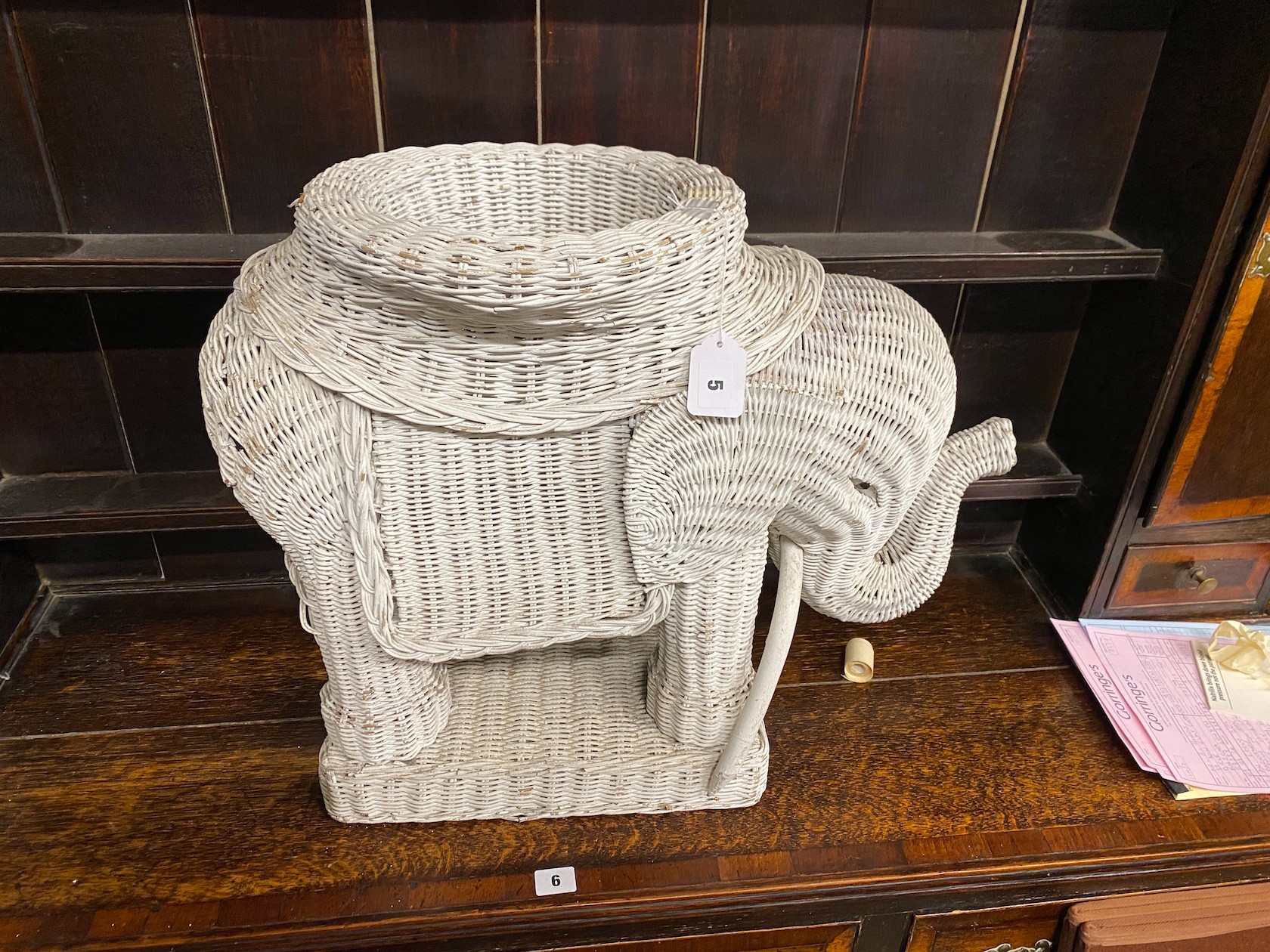 A painted wicker elephant jardiniere, height 50cm